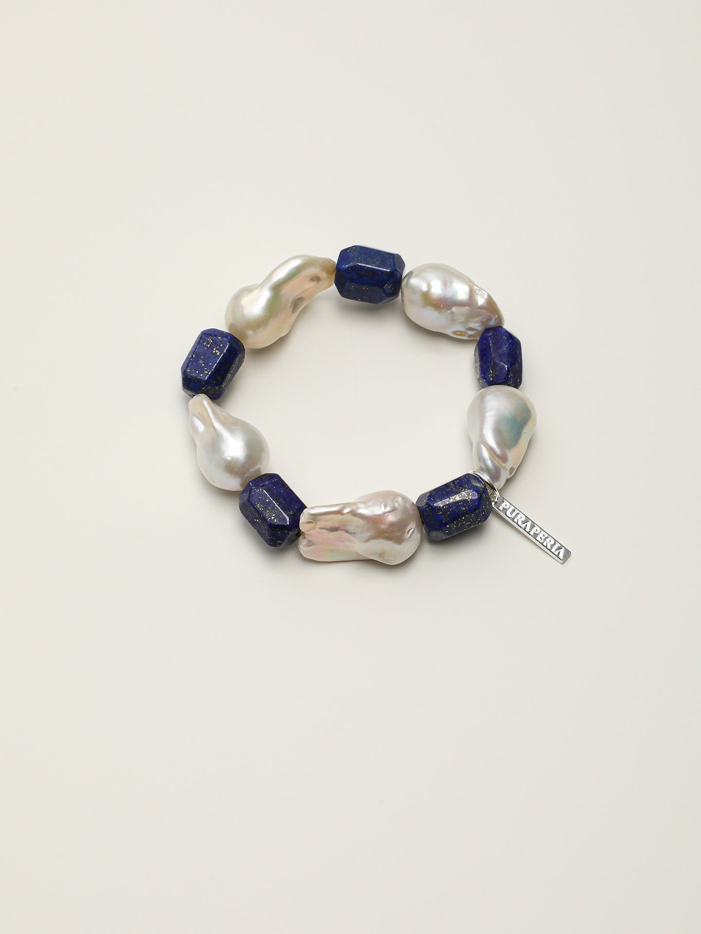 Large Baroque Lapis Lazuli Bracelet — large baroque pearl, freeform lapis lazuli, sterling silver logo charm | SENLORE