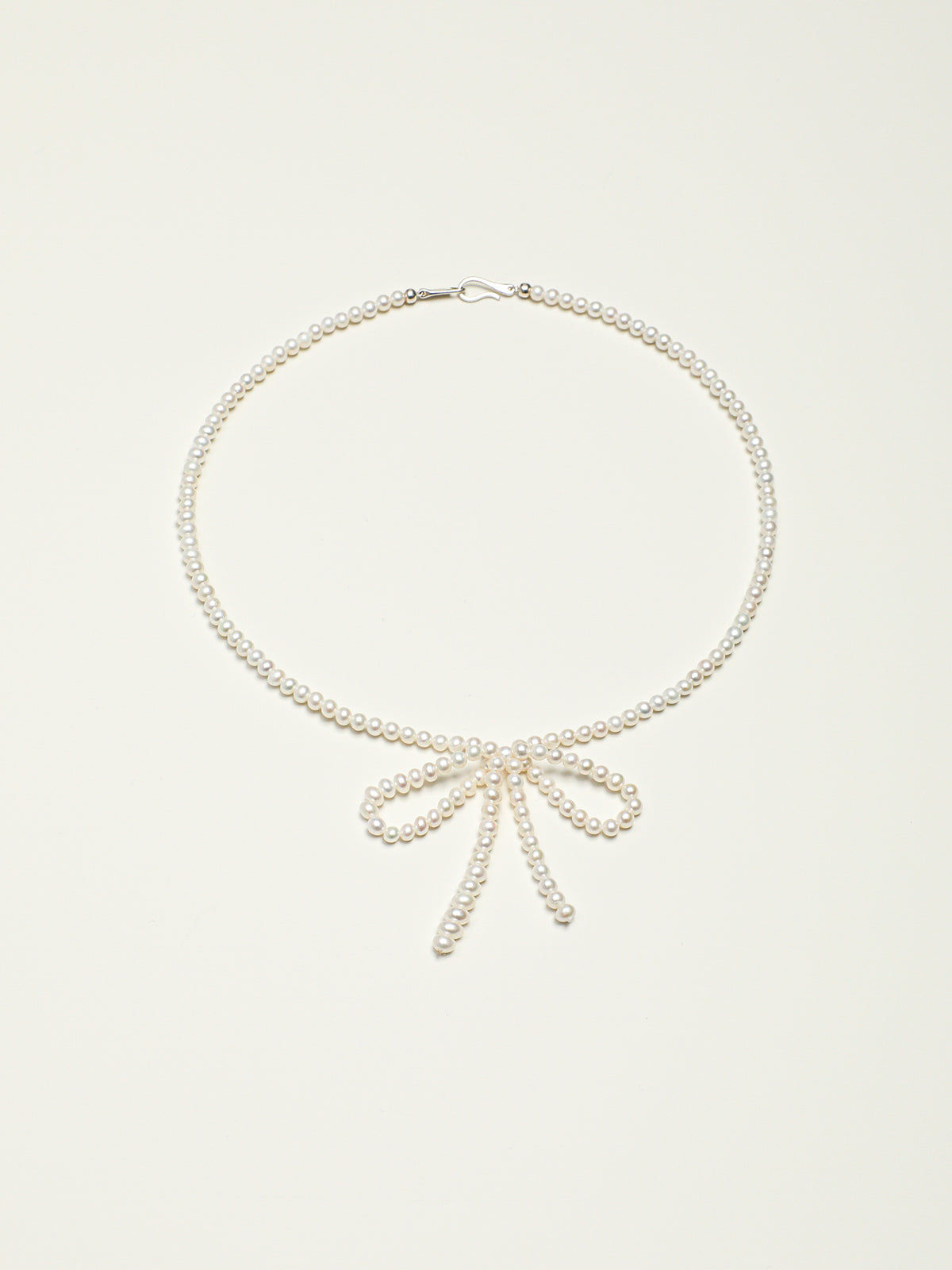 Classic Elegance Bow-Knot Pearl Necklace — natural seed pearls, sterling silver large-hole bead... | SENLORE